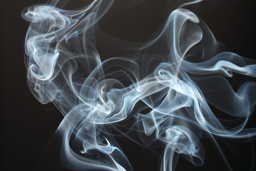 White smoke on black background